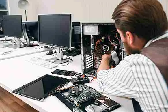 Technician fixing PC at computer shop in Ahmedabad